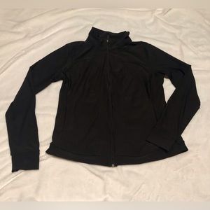 Xersion zip-up black semi fit nylon jacket. Size large.